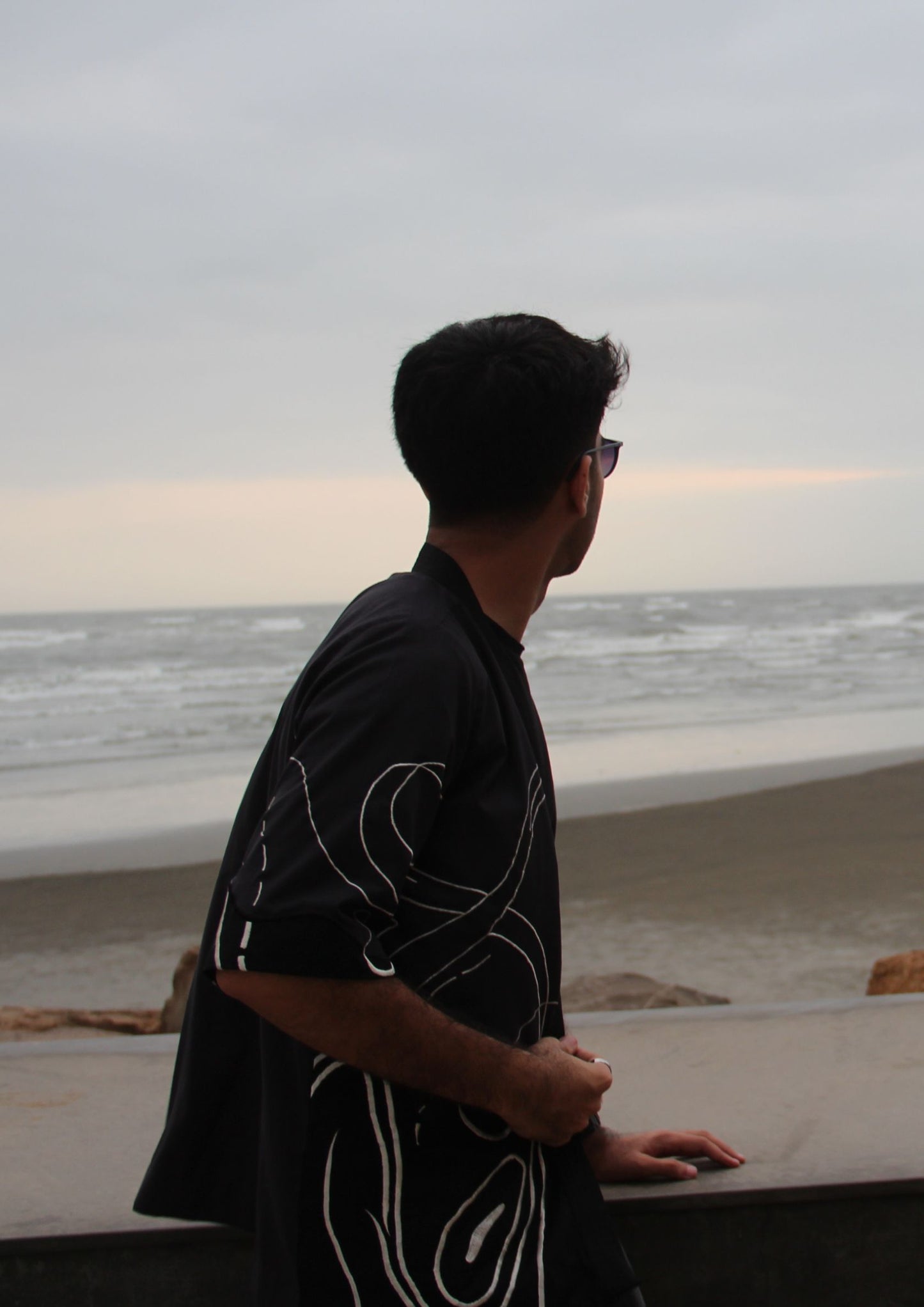 Man wearing Dastaan black, grey, blue and white patterned jacket, kimono, cardigan. Made with Premium Material and Cultural Significance.