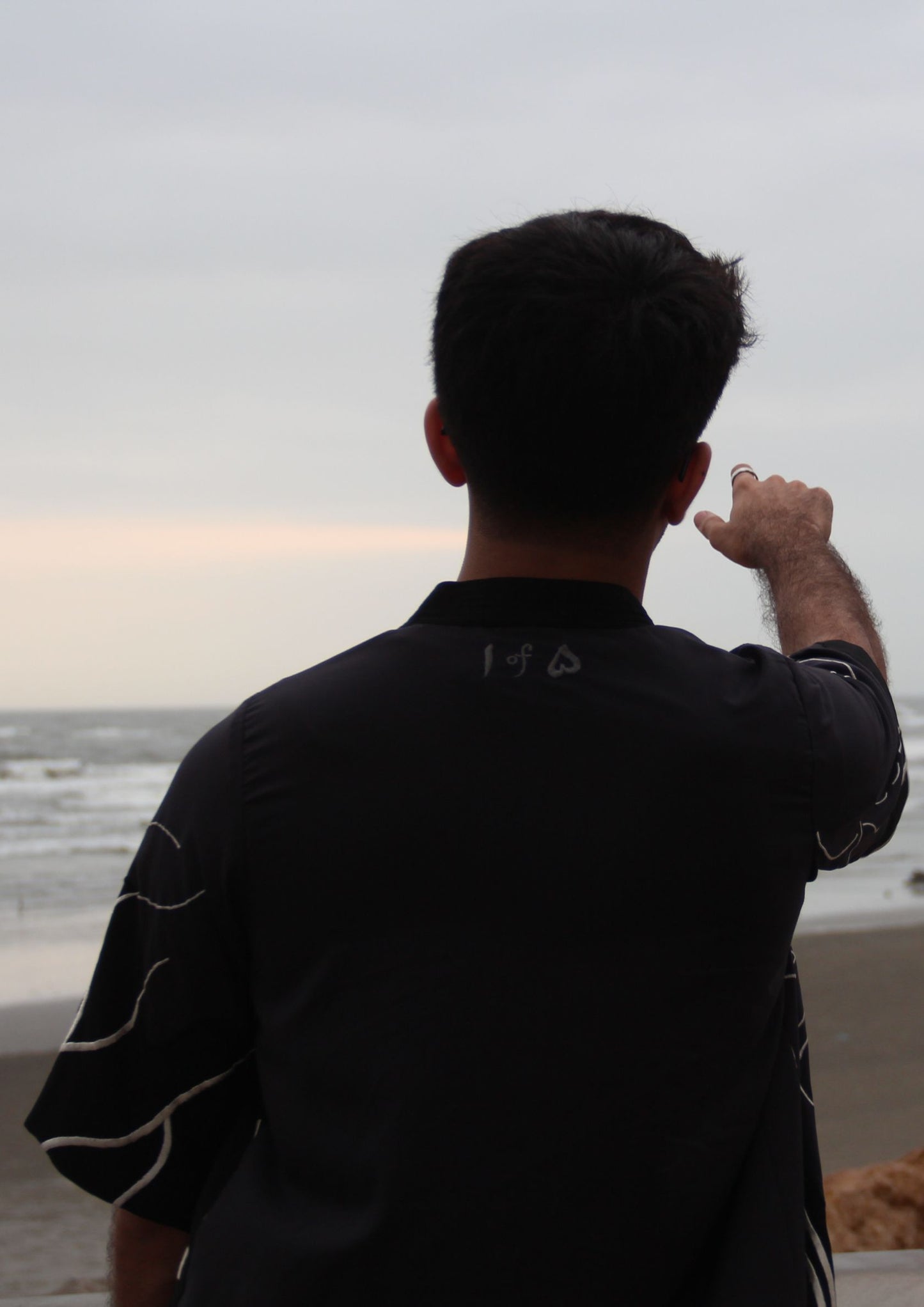 Man wearing Dastaan black, grey, blue and white patterned jacket, kimono, cardigan. Made with Premium Material and Cultural Significance.